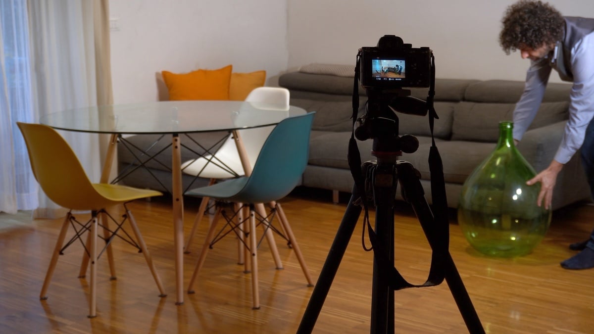 Photographer preparing a room to take a photo