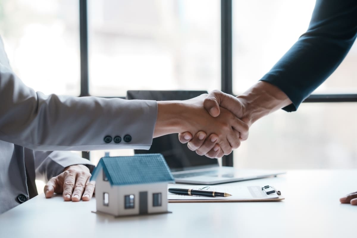 Property managers shaking hands, property owners concept