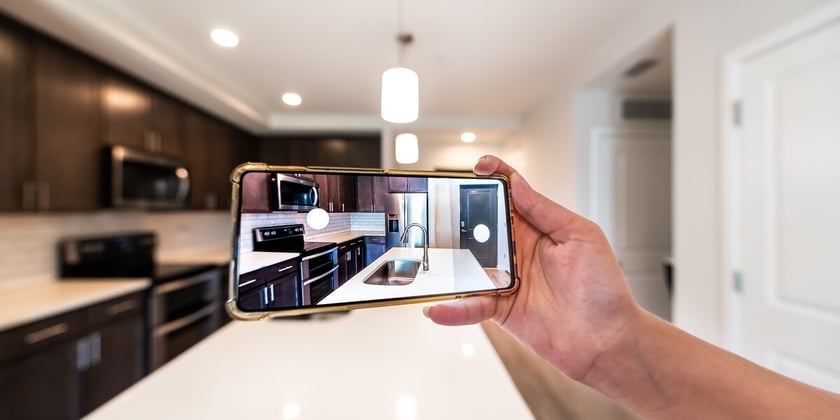 Taking a photo of the kitchen using a cellphone