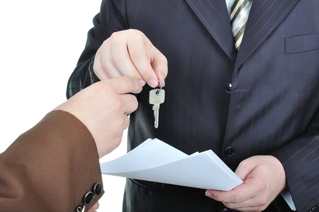 Two businessmen hands and the key, paper agreement-1