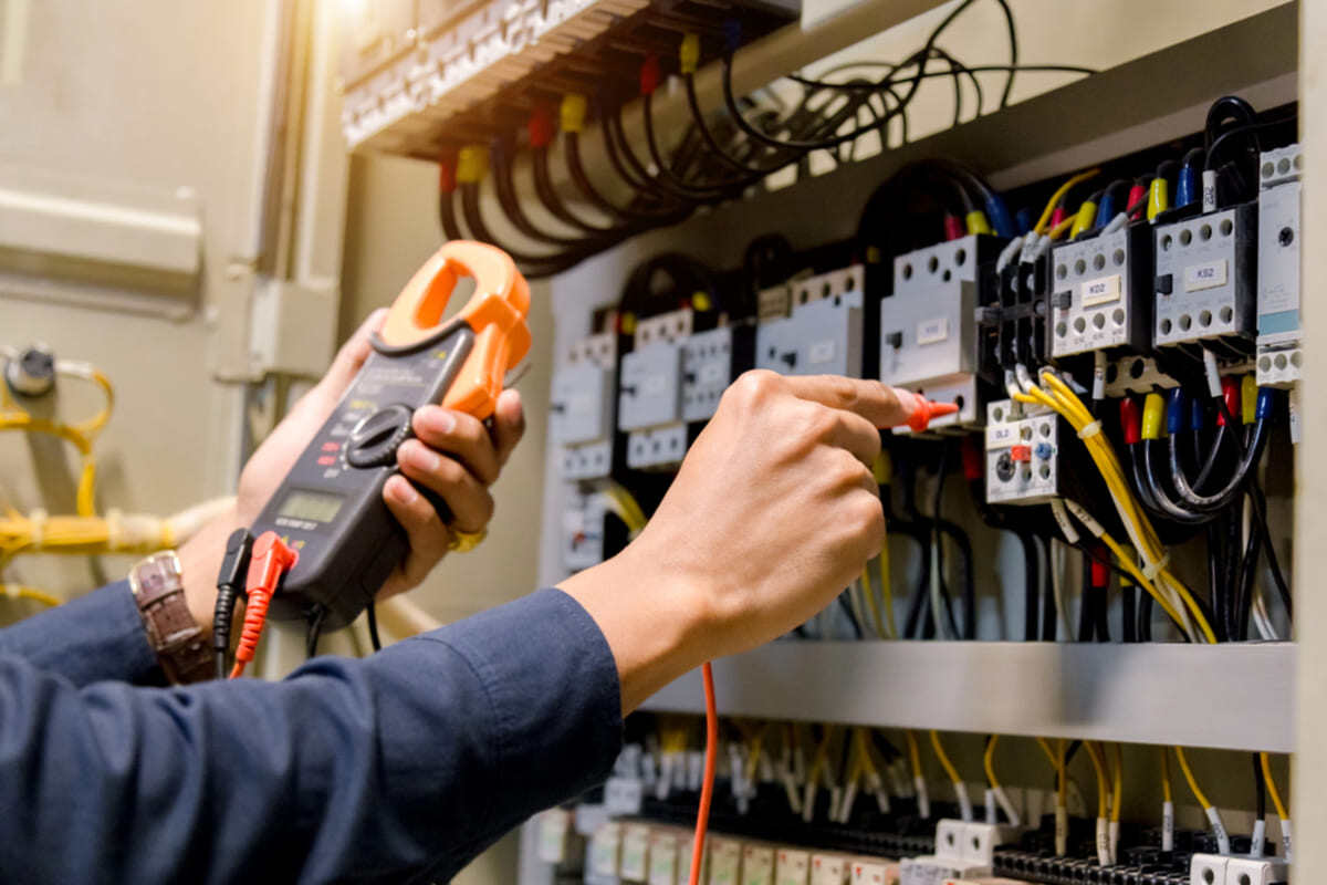 An engineer performing electric work, Seattle specialists concept. 