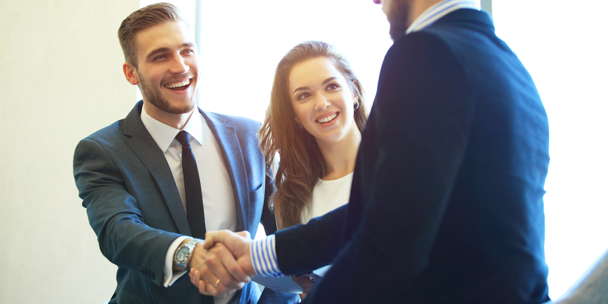 4 Business people shaking hands